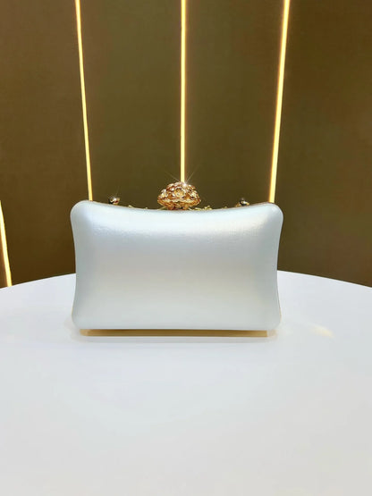 Banquet clutch in pale blue satin with ornate gold crystal-top clasp