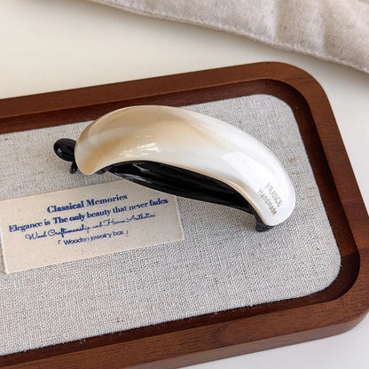 Retro acetate high ponytail clip, ivory white with black underside, handcrafted in France.