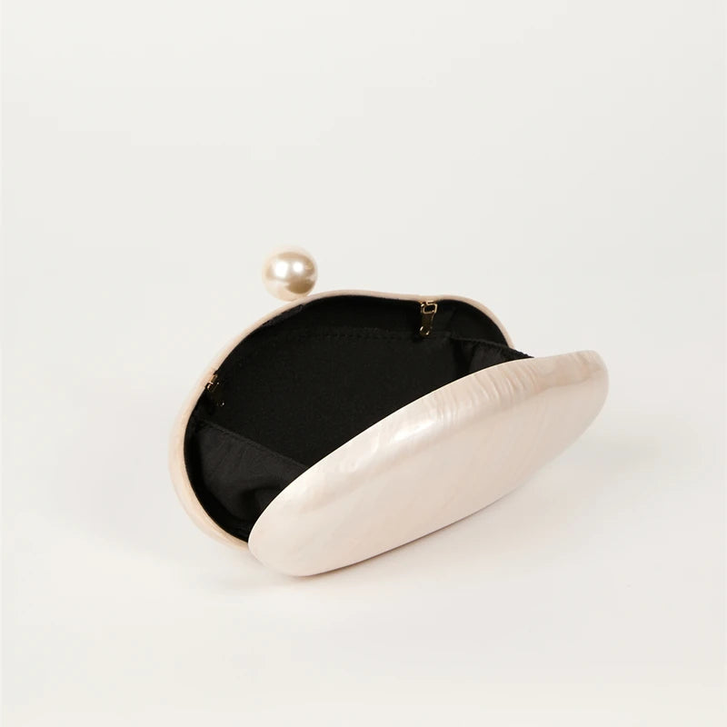 Edenista shell clutch bag ivory pearl color acrylic exterior with gold clasp and black lining