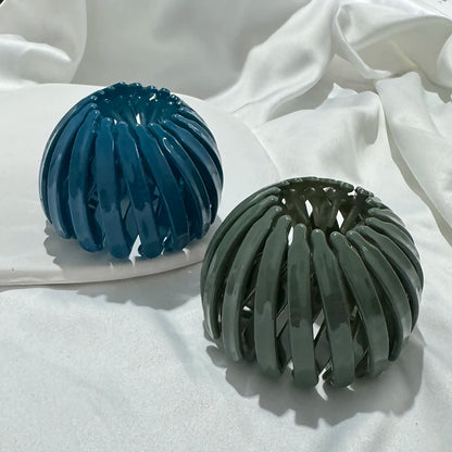 Bun hair clips set, plastic bird-nest design in blue and green; expandable claw-style (2 pcs)