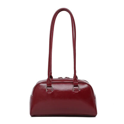 Women's burgundy patent leather bowling bag with double top handles
