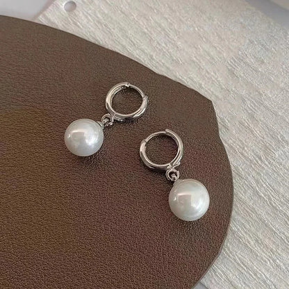 Pair of silver hoop earrings with pearl drops for women, party jewelry