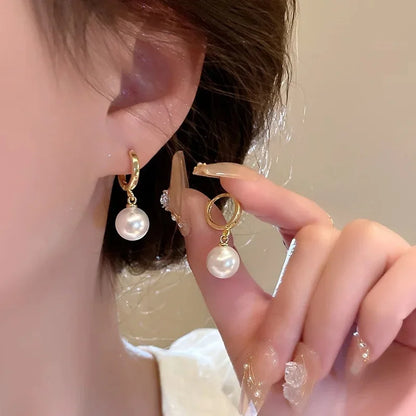 Gold-plated imitation pearl zircon hoop earrings by Edenista, a pair with pearl drops