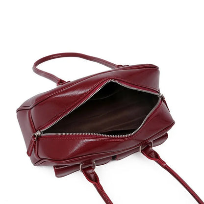 Edenista women's red bowling bag with multiple pockets, top zipper, and shoulder strap