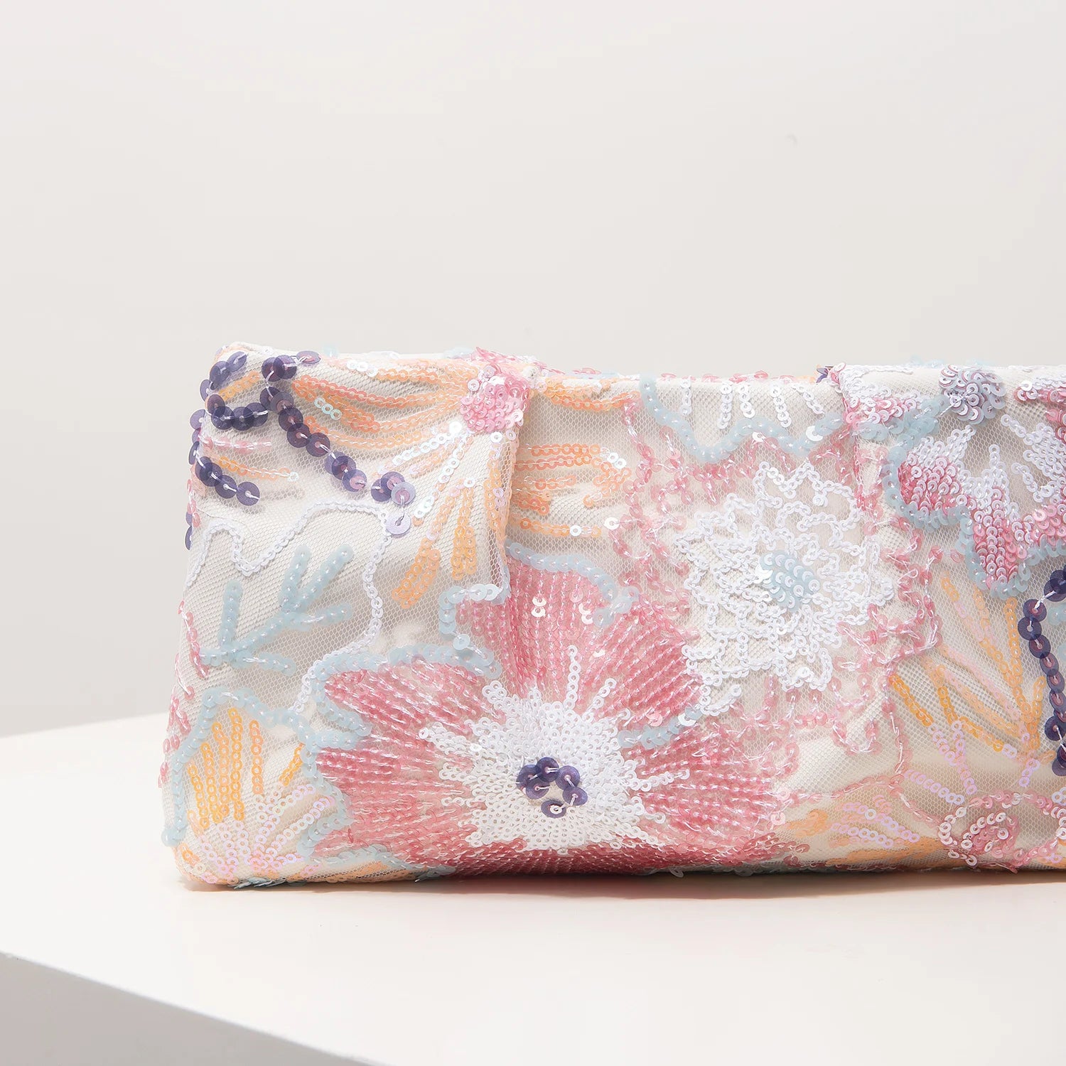 Clutch bag with pastel sequin floral embroidery, gala-ready