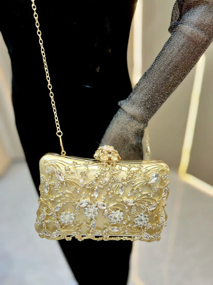 Gold-tone banquet clutch with crystal floral embellishments and chain strap