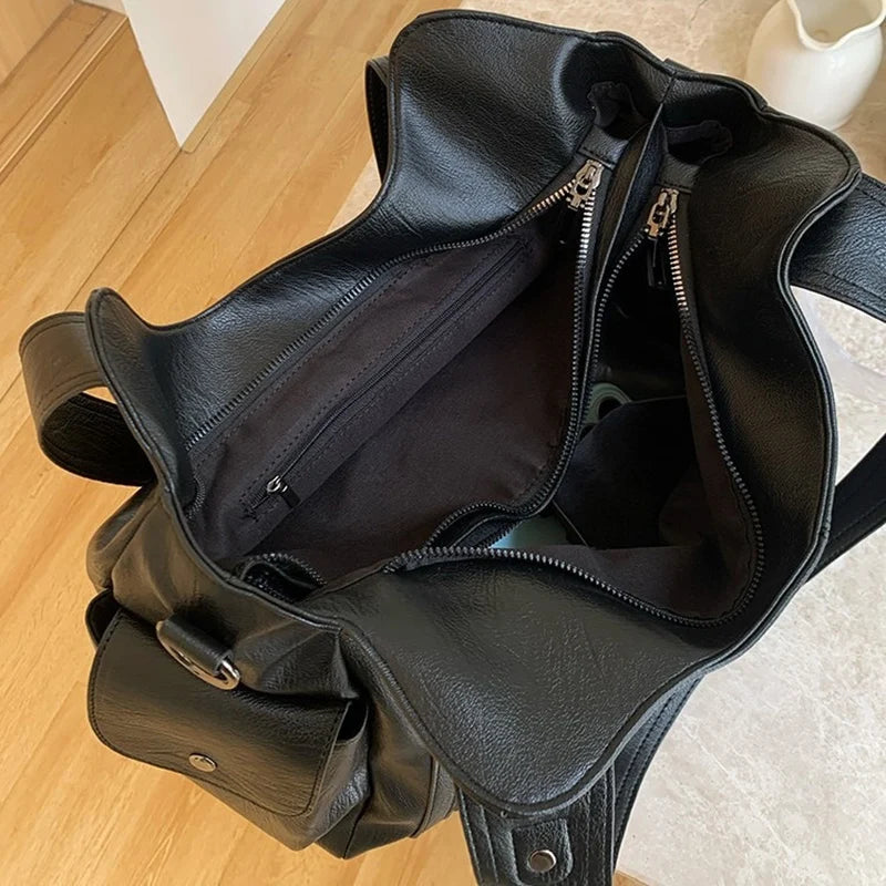 Edenista women’s black leather tote bag with large capacity, crossbody/shoulder strap and multiple interior pockets