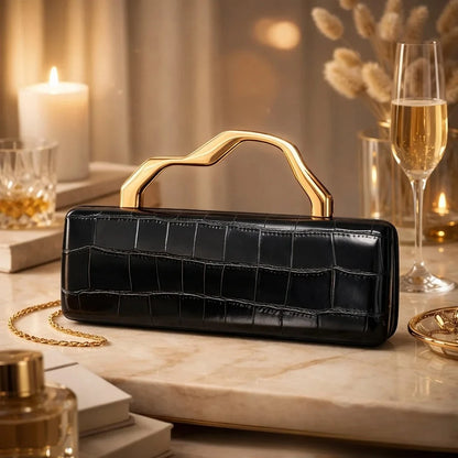 Black crocodile-pattern PU evening clutch with a gold-toned sculpted handle