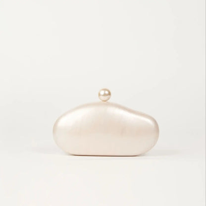 Shell clutch bag by Edenista in ivory pearl acrylic with pearl knob