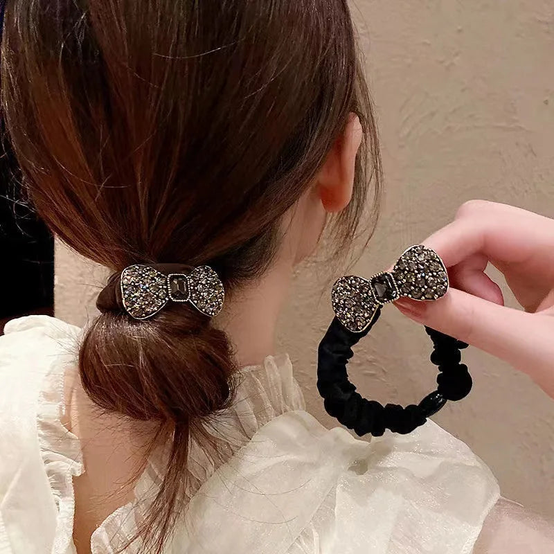 Rhinestone bow scrunchies pair; brown and black elastic hair bands