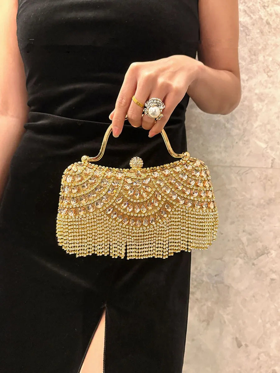 Gold-tone diamond evening clutch with rhinestone beadwork and fringe tassel.