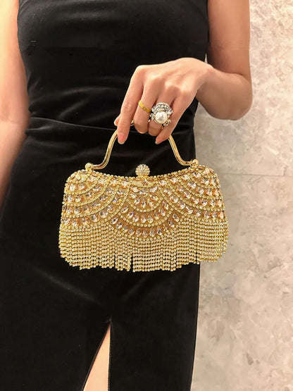 Gold-tone diamond evening clutch with rhinestone beadwork and fringe tassel.