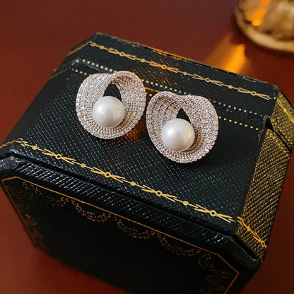 Edenista pair of zircon round pearl stud earrings with pavé halos, silver-tone setting