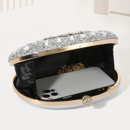 Evening clutch Edenista with crystal-embellished lid, gold frame, black satin interior, chain strap