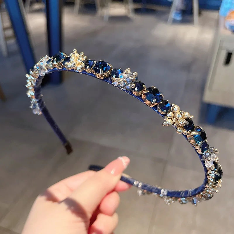 Korean fashion headband with blue rhinestones and clear crystals on a purple band