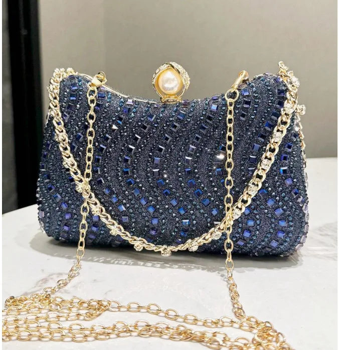 Edenista blue rhinestone evening clutch with pearl clasp and gold chain strap