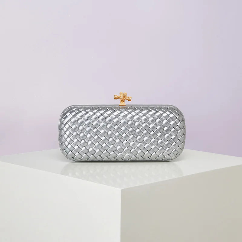 Crossbody evening bag by Edenista in metallic silver woven PU with gold-tone clasp