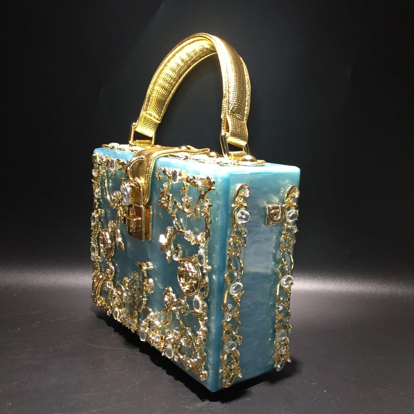 Edenista acrylic evening bag with gold rhinestone filigree on turquoise box clutch