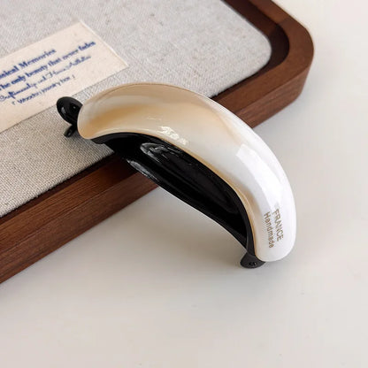 Edenista retro acetate hair clip, cream and black curved buckle design for high ponytail styling