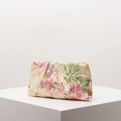 Edenista clutch bag with pastel pink floral embroidery and sequin details
