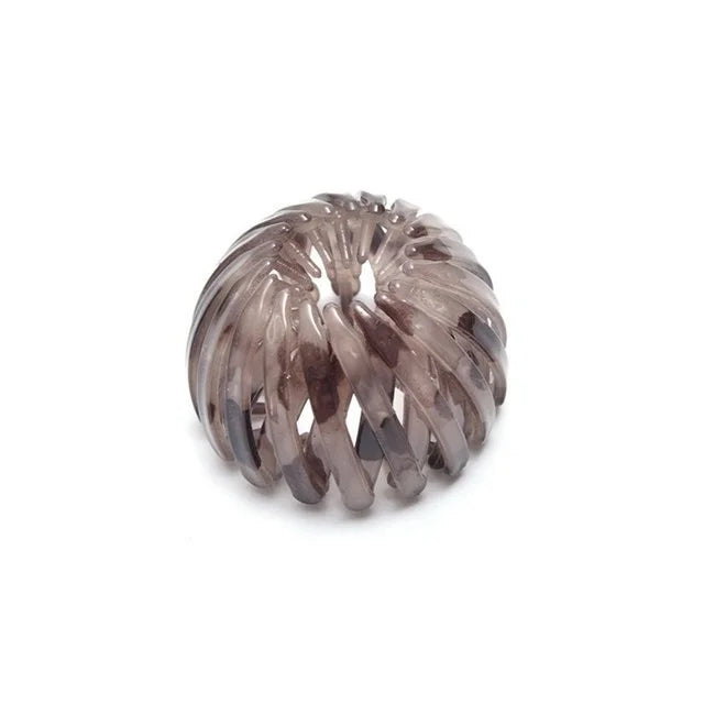 Bun hair clip ball in smoky brown translucent plastic; expanding bird-nest style clip
