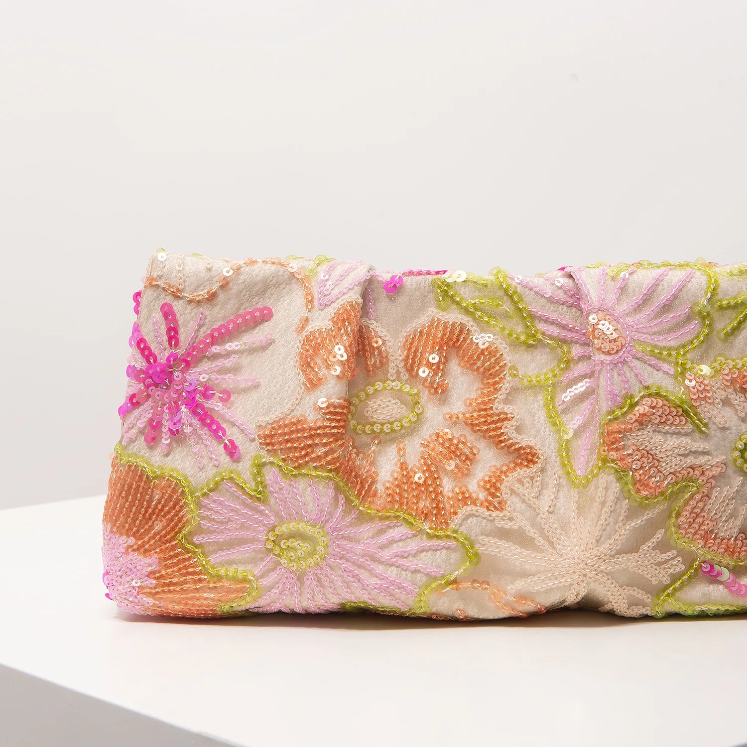 Edenista clutch bag with multicolor sequin floral embroidery on light fabric