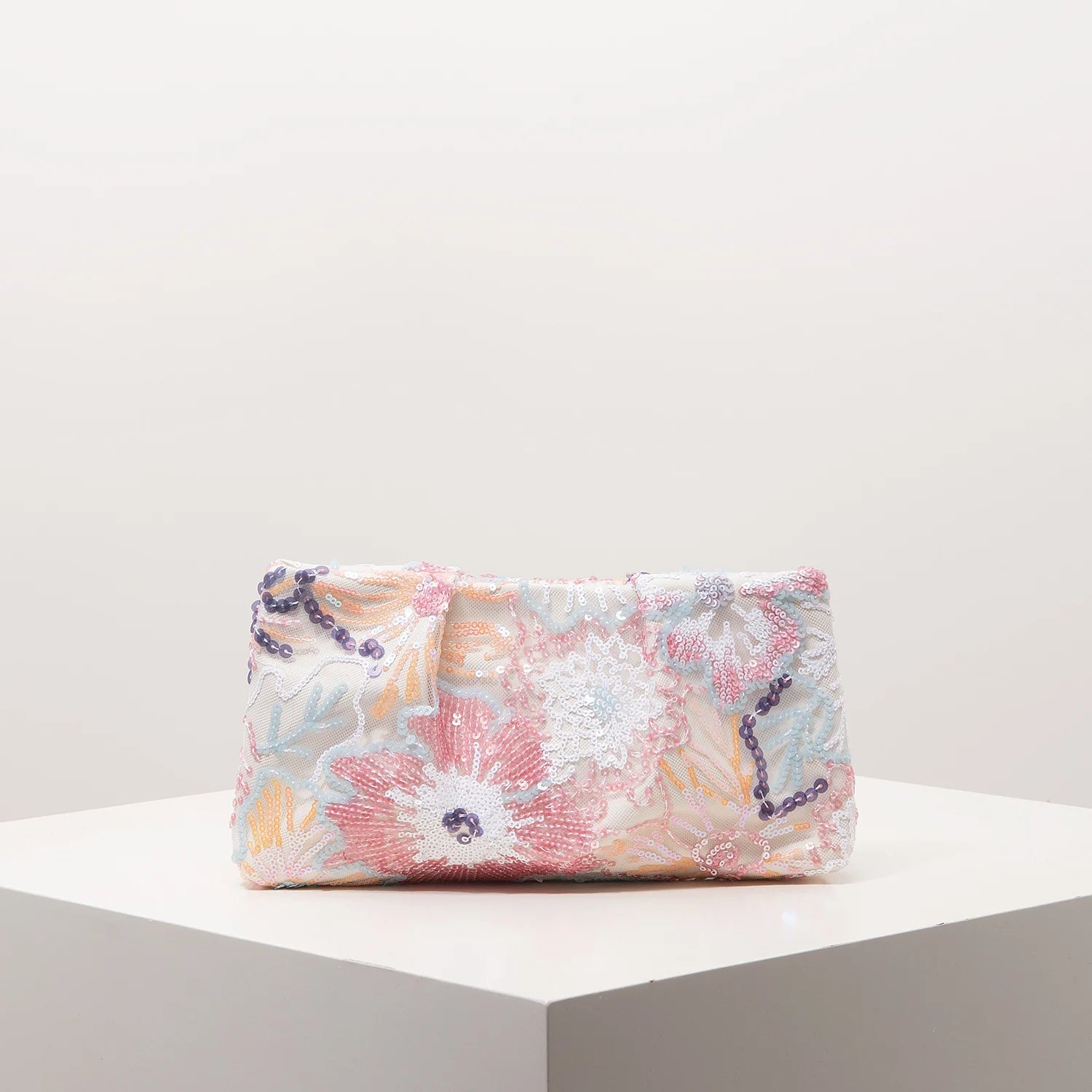 Clutch bag with pastel floral sequin embroidery and purple bead chain strap