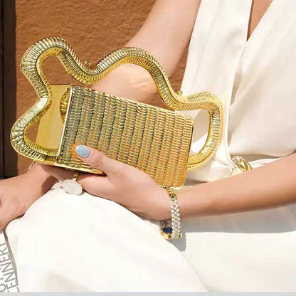 Gold woven clutch purse with oversized wavy metallic handle for evening events