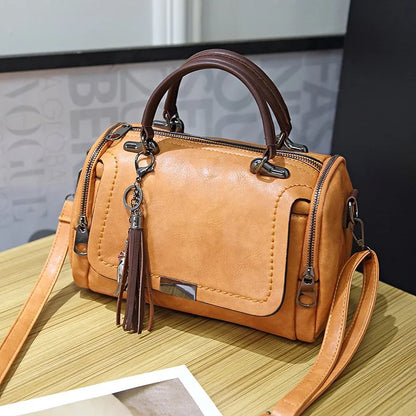 Edenista tan leather retro shoulder bag with tassel charm, top handles, crossbody strap
