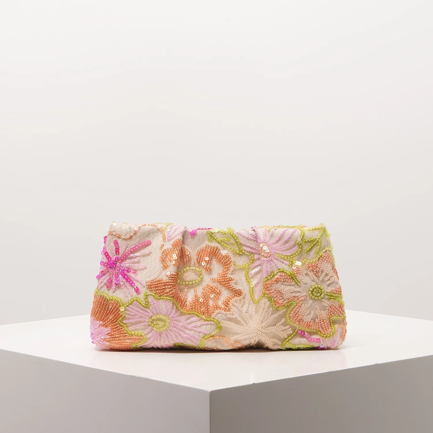 Edenista clutch bag with floral sequin embroidery in pink, peach and lime on light fabric