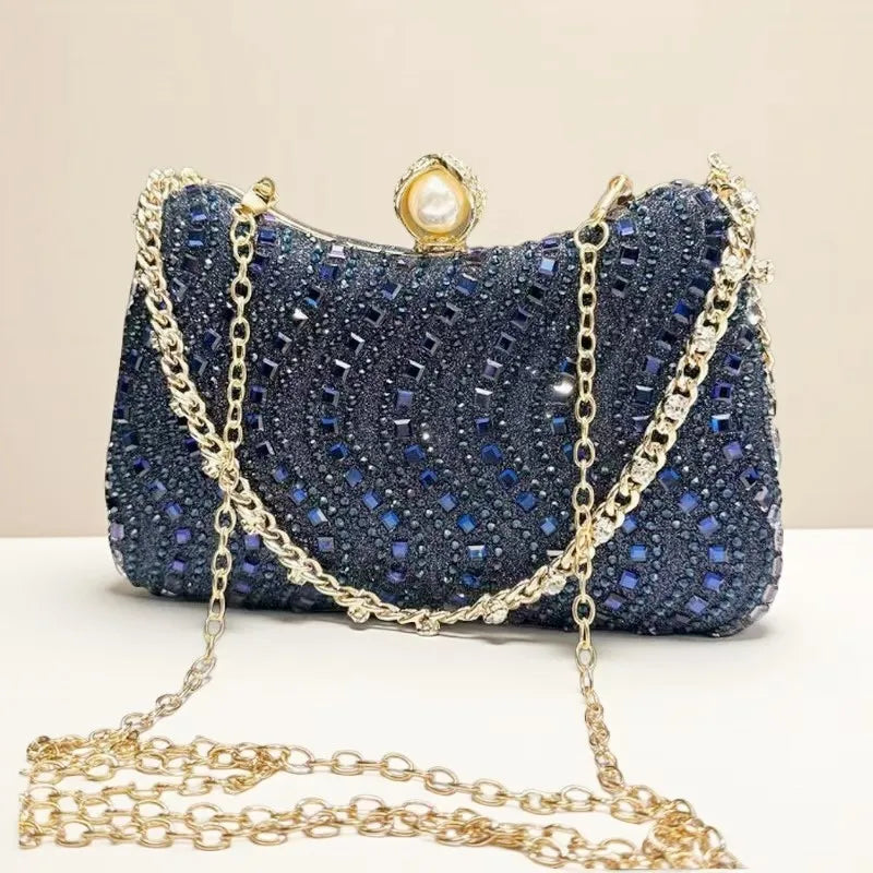 Blue rhinestone evening clutch by Edenista with gold chain strap and pearl clasp.