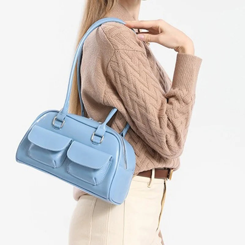Bowling bag for women in light blue with dual front pockets and top handles
