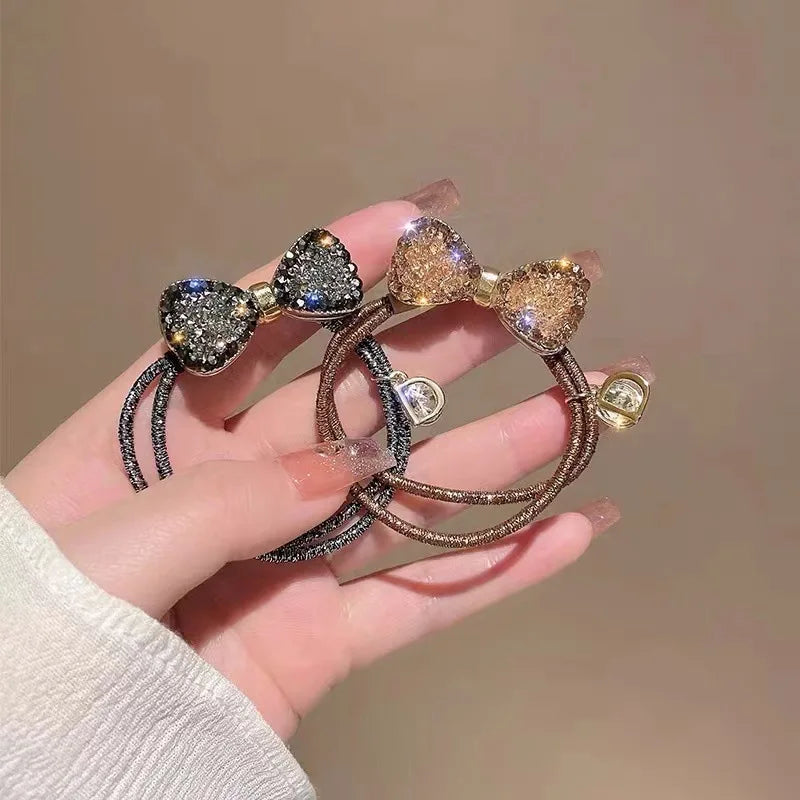 Fashion rhinestone bow scrunchies by Edenista; 2 elastic hair ties with black and rose-gold glitter bows