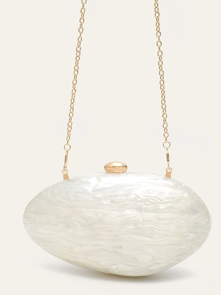 Edenista shell-shaped acrylic clutch in pearl white with gold chain strap