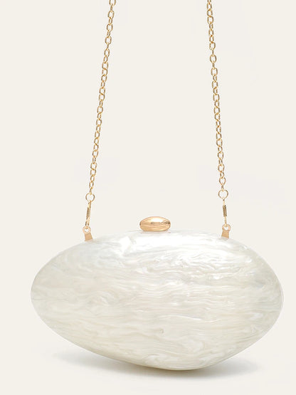 Edenista shell-shaped acrylic clutch in pearl white with gold chain strap