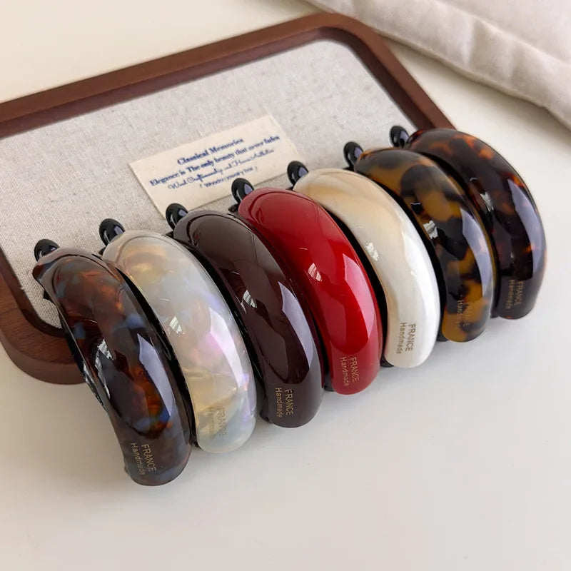 Retro acetate hair barrettes by Edenista; 8-piece set in tortoiseshell, red, white, cream, and black