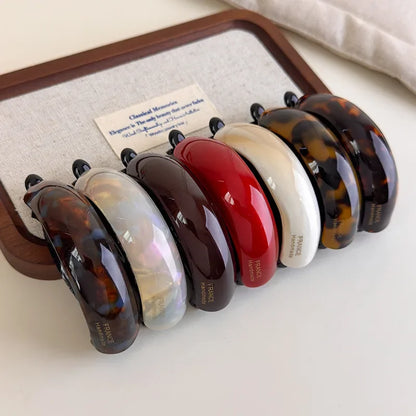 Retro acetate hair barrettes by Edenista; 8-piece set in tortoiseshell, red, white, cream, and black