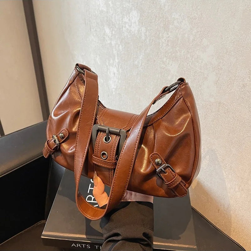 Women's brown leather hobo shoulder bag with buckle accents