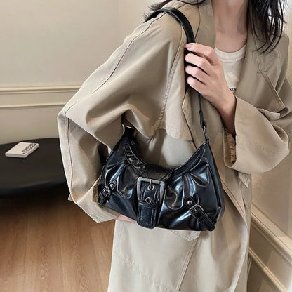 Women’s hobo handbag by Edenista, black faux-leather with buckle details carried over the shoulder