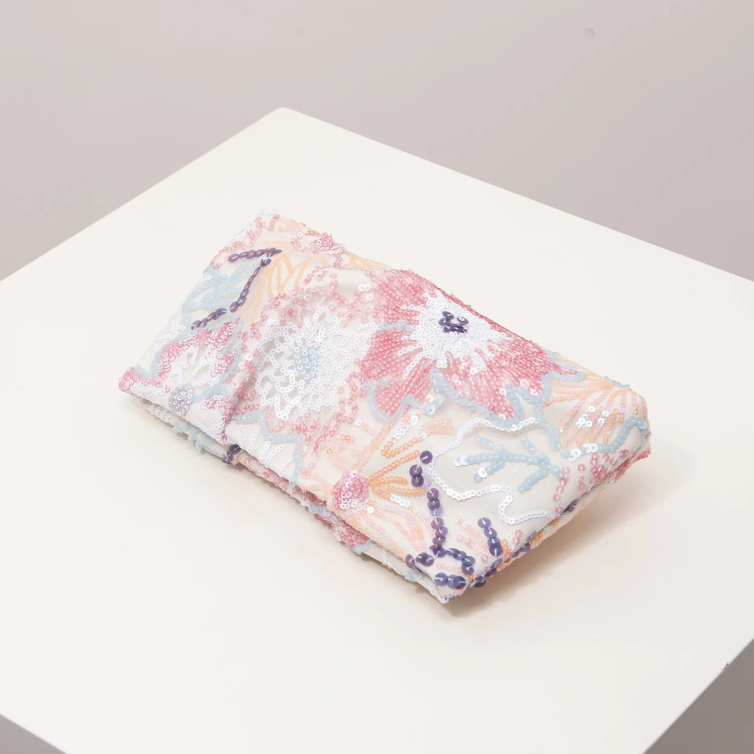 Clutch bag with pastel floral sequin embroidery in pink, peach and blue