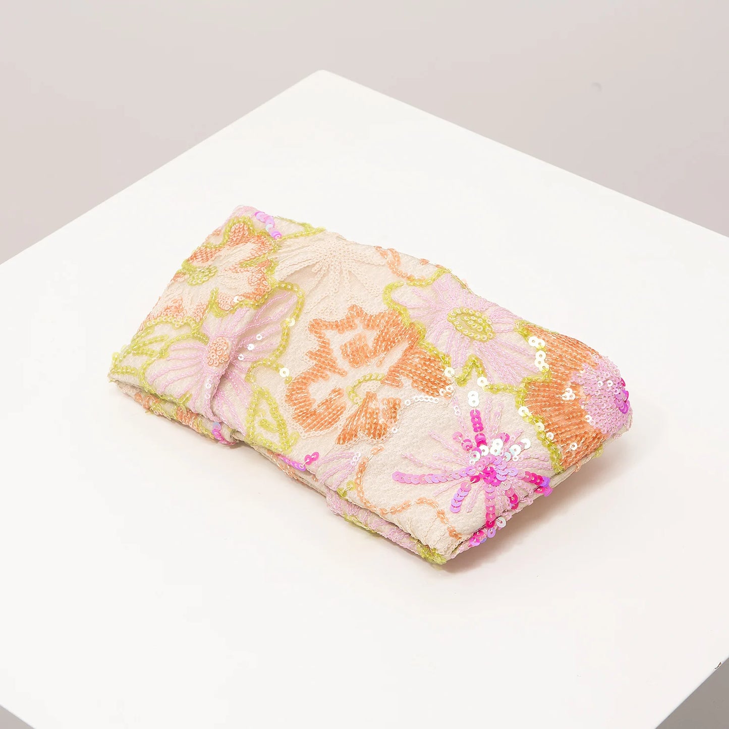 Clutch bag with pastel floral sequin embroidery in pink, peach and lime tones