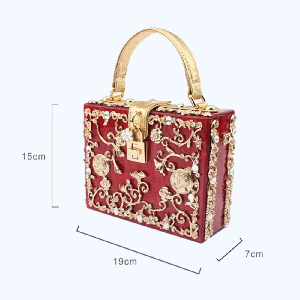 Edenista red acrylic evening bag with gold-tone rhinestone embroidery and a top handle