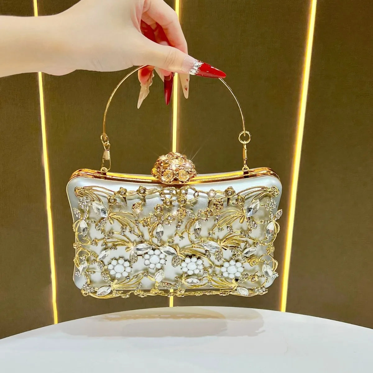 Diamond-embellished banquet clutch with gold floral filigree on white enamel, sparkling evening bag