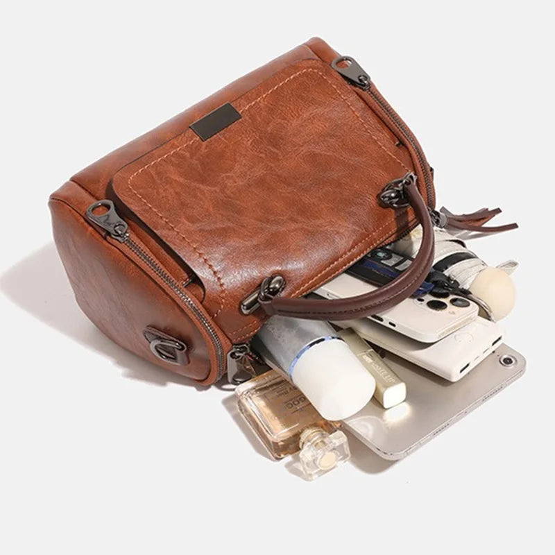 Brown faux leather retro shoulder bag with tassel decor and crossbody strap