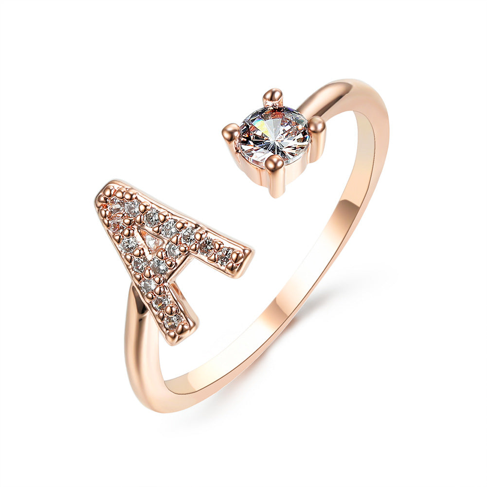 Rose gold adjustable initial A ring with crystal-studded letter and solitaire stone by edenista