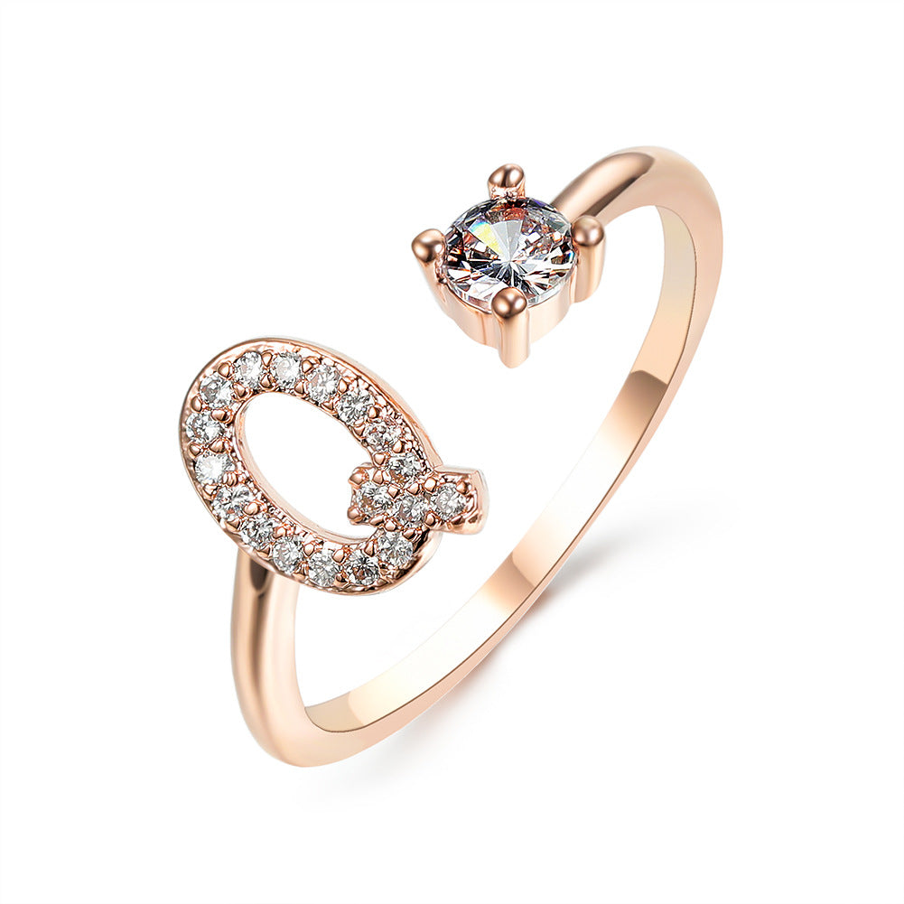 Rose gold adjustable initial letter ring with pave crystals and a solitaire stone by edenista