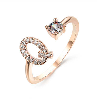 Rose gold adjustable initial letter ring with pave crystals and a solitaire stone by edenista