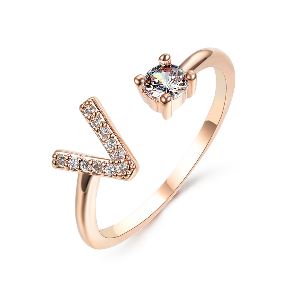 Initial letter ring by Edenista, rose gold adjustable with pavé diamonds and a solitaire stone
