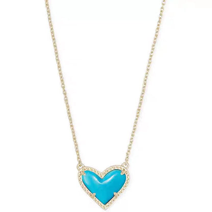 Cubic Zirconia Heart Pendant Necklace with turquoise blue heart and crystal border on a gold-tone chain.