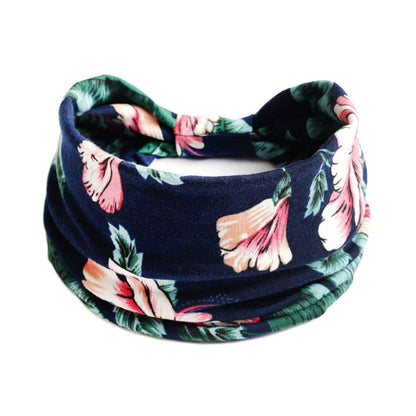 Yoga headband with navy floral print and pink flowers